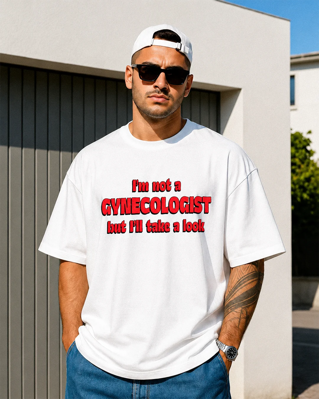 White oversized “I’m Not a Gynecologist But I’ll Take a Look” t-shirt