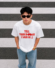 White oversized “Tell Your Boobs I Said Hi :)” graphic t-shirt