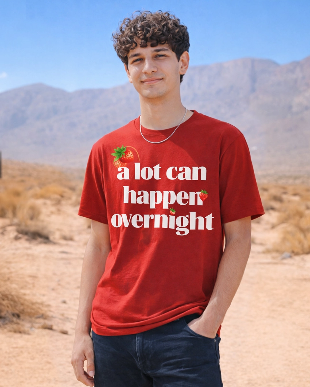     Red oversized graphic t-shirt with “A Lot Can Happen Overnight” print